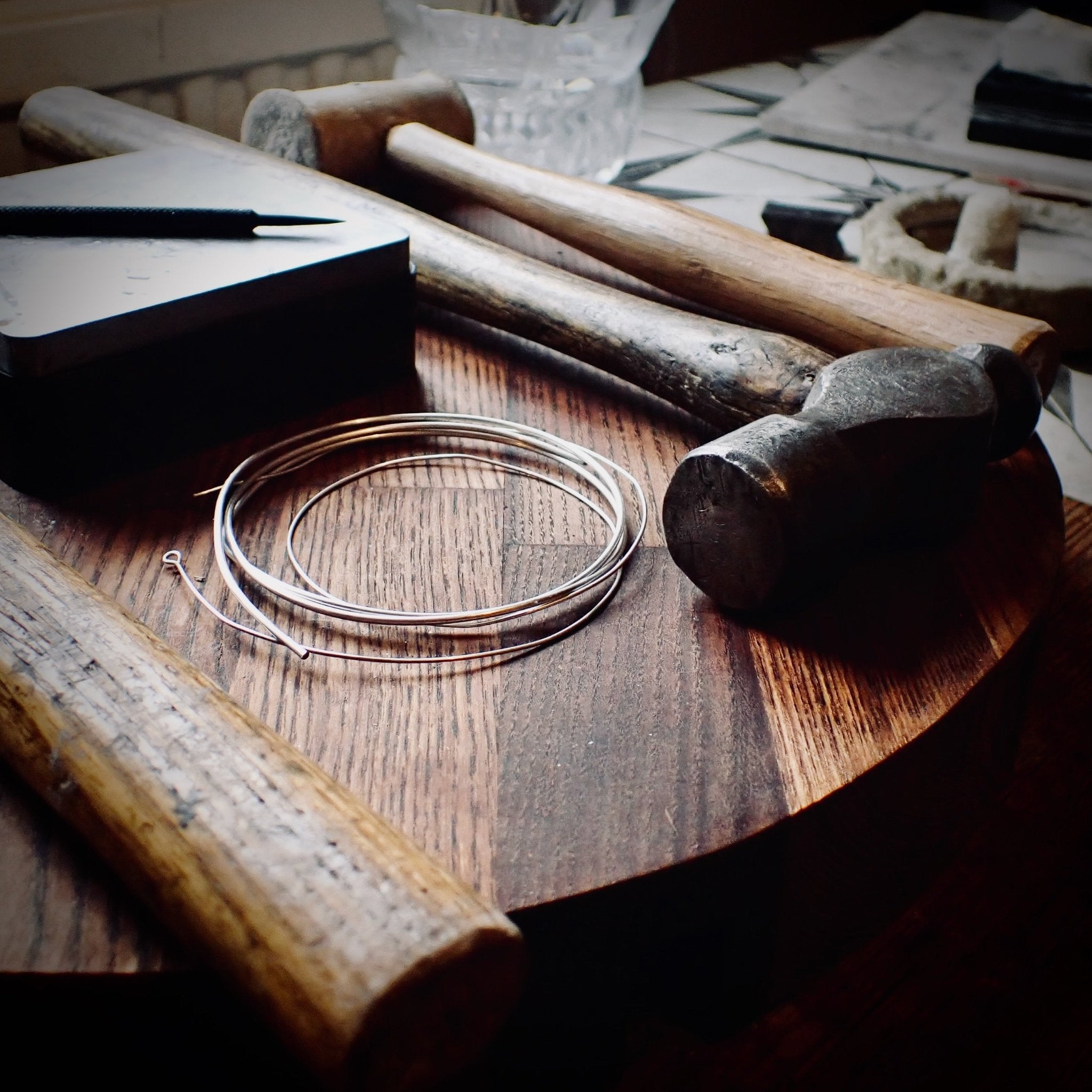 hammers and silver wire on my workbench