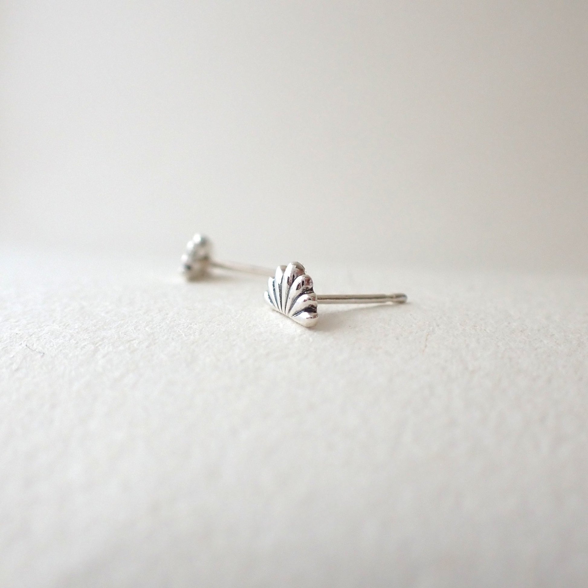 side view of handmade lotus flower earrings to show depth of metal used (i.e. 3D design, not thin)