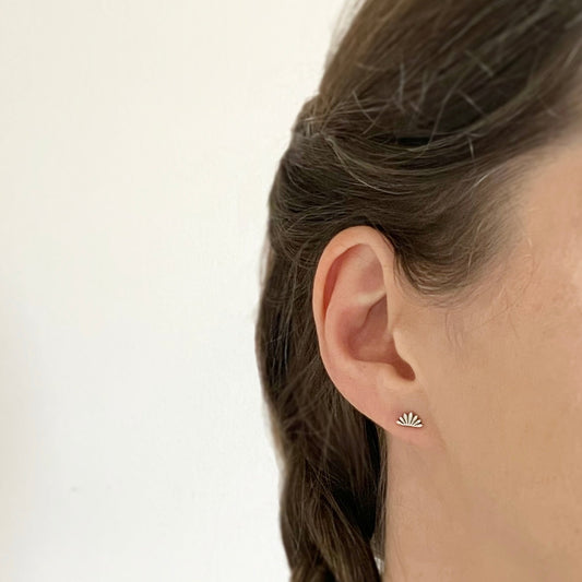 modelled photo of waterlily / lotus flower earring to show it looks quite dainty on the ear but still eyecatching